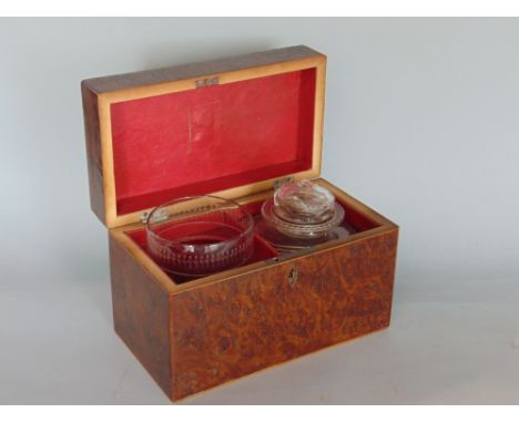 19th century burr or yew wood tea caddy, the hinged lid enclosing an interior fitted with a decanter and mixing cup, 19cm wid