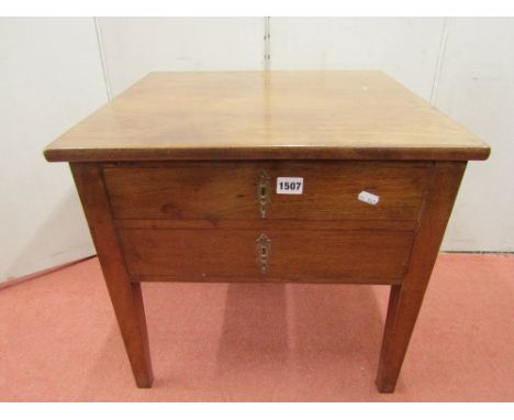 A Georgian mahogany box commode, the front elevation enclosed by two simulated drawers raised on square taper supports (inter