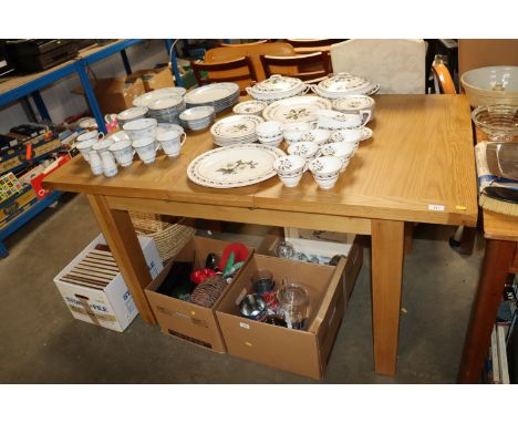 A modern light oak extending dining room table 