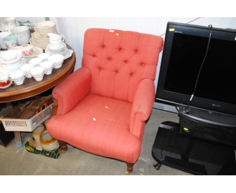 A button back upholstered armchair