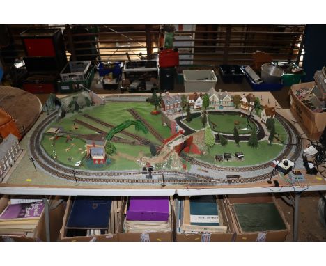 A model OO gauge railway trainset mounted to board, (board measuring approx.. 38" x 64") with electronic motor control, LED l