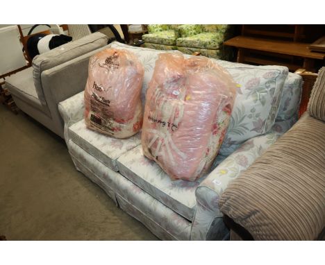 A floral upholstered sofa bed