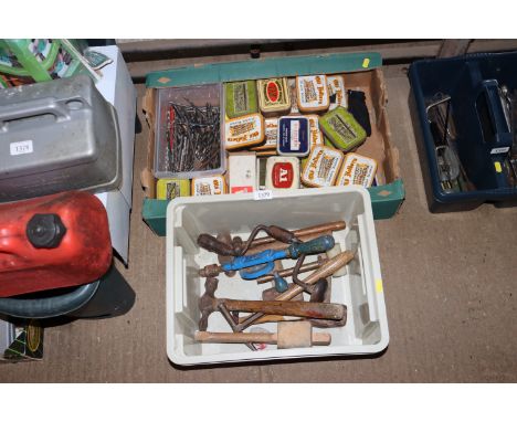 Two boxes containing various tools to include wooden mallet, hammer, hand braces, and a quantity of various assorted fixings,