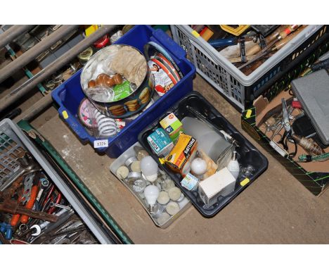 Three boxes containing various items to include candles, light bulbs, turned wooden curtain pole ends etc.