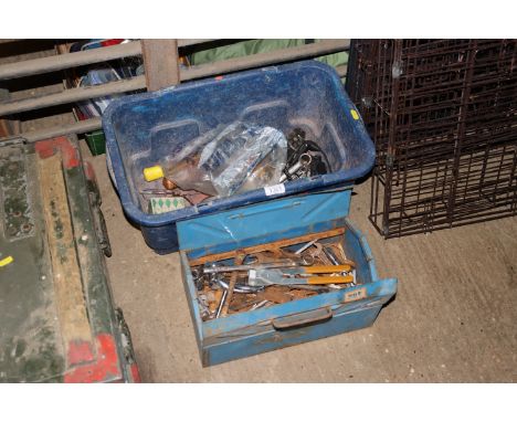A plastic tub containing various tools to include spanners, hammers, and further metal tool box and contents of further tools
