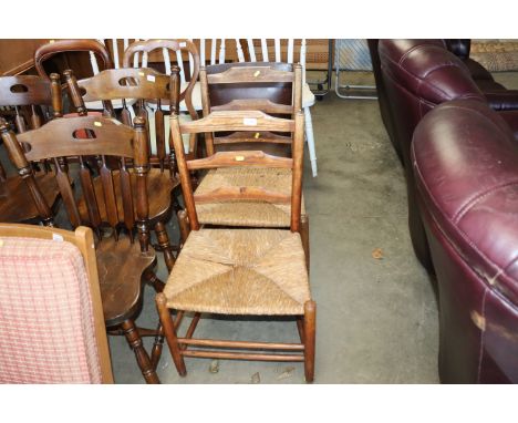 Two oak ladder back rush seated chairs
