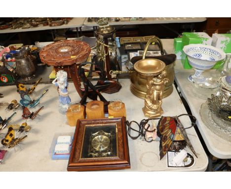 A brass coal scuttle, a companion stand, carved wooden occasional table, a figure group in the form of stylised dancers, Tiff