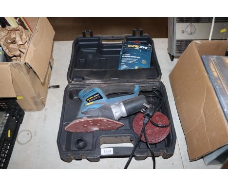 A Workzone WWMS-200/14 3-in-1 multi sander in fitted plastic case with a quantity of Workzone sanding sheets