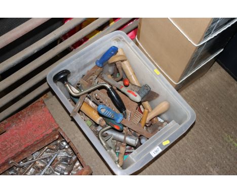 A box containing various tools to include files, hand brace, drill bits, builders trowel etc.