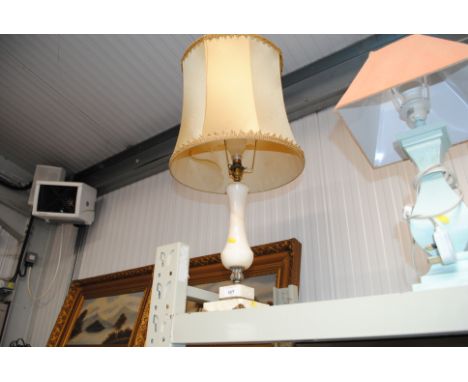 An alabaster table lamp and shade