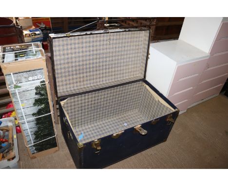 A metal bound travelling trunk
