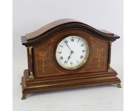 A French inlaid mahogany dome-top mantel clock, white enamel dial with Roman numeral hour markers, brass pillar supports, cas