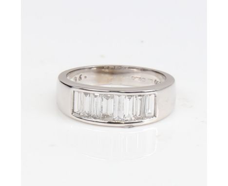 A modern 18ct white gold diamond quarter eternity ring, set with baguette-cut diamonds, total diamond content approx 0.9ct, s