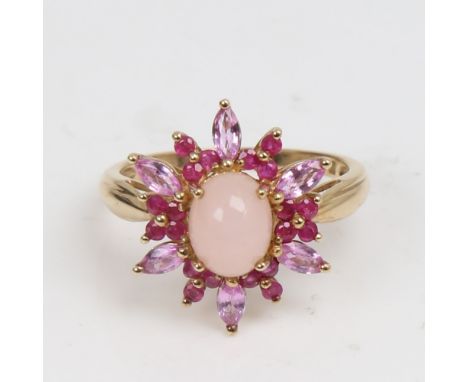 A modern 9ct gold rose quartz ruby and pink sapphire cluster snowflake dress ring, set with oval cabochon quartz, round rubie