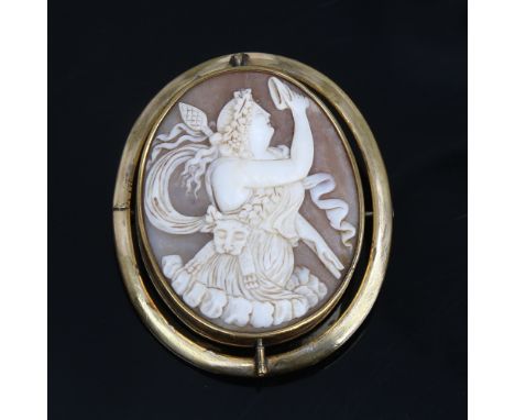 A Victorian relief carved shell cameo swivel brooch, depicting Bacchante lady with lion pelt and thyrsus, with vacant photogr
