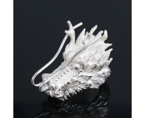 A large handmade sterling silver figural dragon ring, length 52.4mm, size V, 50.3gNo damage or repairs, settings very lightly