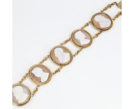 An Antique unmarked yellow metal 5-panel cameo bracelet, relief carved shell panels with profile design and beaded borders, o