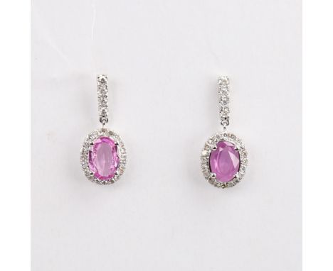 A modern pair of 14ct white gold pink sapphire and diamond cluster drop earrings, set with oval mixed-cut sapphire and modern