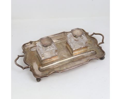 An Edwardian silver 2-handled deskstand, rectangular form with scalloped rim, 2 pen trays and silver-mounted square glass ink