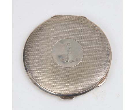 A George V Art Deco circular silver compact, allover engine turned decoration with engraved emblem and motto "Certa Cito", by
