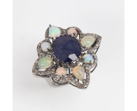 A large modern oxidised silver sapphire opal and diamond star ring, openwork set with oval mixed-cut sapphire, round and pear