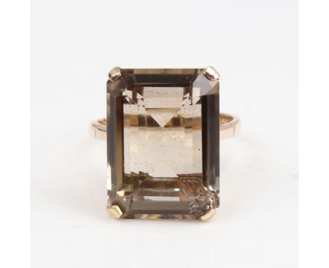 A large late 20th century 9ct gold smoky quartz ring, quartz length 20.2mm, size Q, 6.9gNo damage or repair, facet edges slig