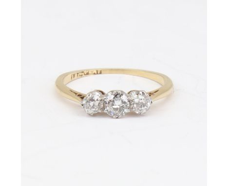 An early 20th century 18ct gold 3-stone diamond ring, set with round brilliant and old-cut diamonds, total diamond content ap