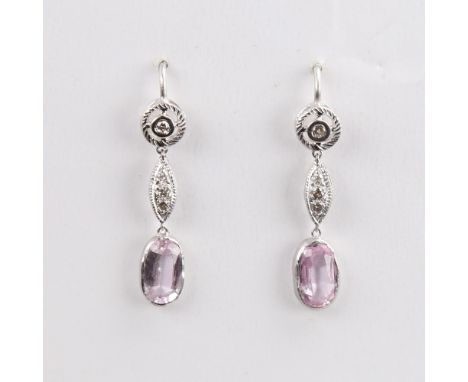 A pair of unmarked white metal pink topaz and diamond drop earrings, set with oval mixed-cut topaz and round brilliant-cut di