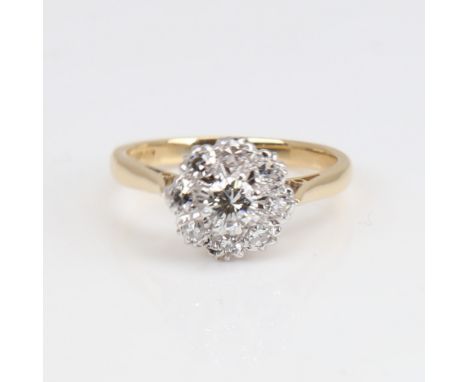 A late 20th century 18ct gold diamond cluster ring, set with modern round brilliant and eight-cut diamonds, central diamond a