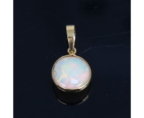 A modern handmade unmarked gold Ethiopian opal pendant, set with round cabochon opal, settings test as 14ct, pendant height 1
