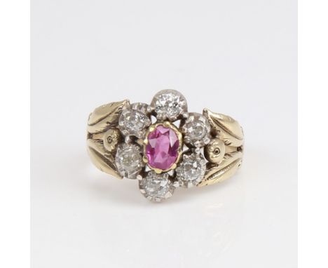 An Antique unmarked gold ruby and diamond cluster flowerhead ring, set with oval mixed-cut ruby and old mine-cut diamonds, to