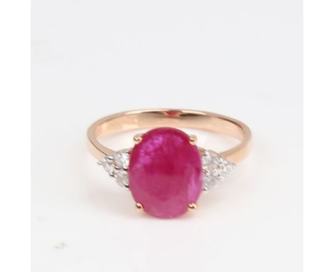 A modern 14ct rose gold ruby and diamond dress ring, set with oval mixed-cut ruby and round brilliant-cut diamonds, total dia