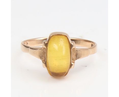 A Continental 14ct gold cabochon yellow stone dress ring, setting height 11.3mm, size P, 2.5gNo damage or repair, stone and s