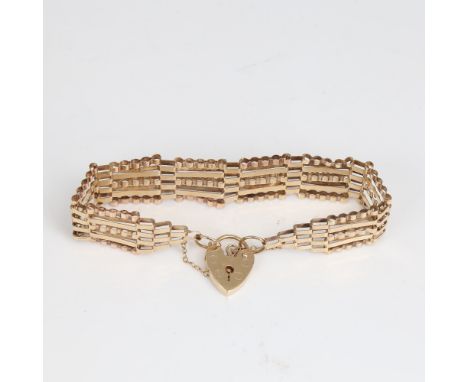 A late 20th century 9ct gold gate link heart padlock bracelet, maker's marks ASJ, hallmarks London 1978, bracelet length 17cm