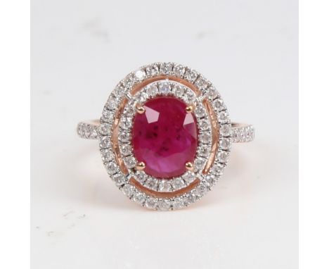 A modern 14ct rose gold ruby and diamond cluster double-halo ring, set with oval mixed-cut ruby and round brilliant-cut diamo