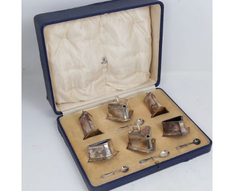 A George V Art Deco silver 6-piece cruet set, geometric triangular form with blue glass liners, by Mappin & Webb, hallmarks B