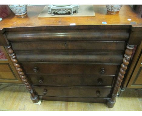 A VICTORIAN SCOTCH CHEST of inverted breakfront outline the shaped moulded top above five long drawers between spiral twist c