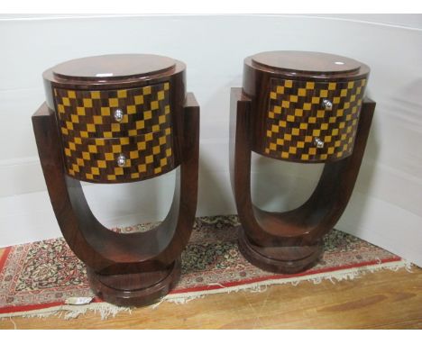 A PAIR OF ART DECO STYLE ROSEWOOD INLAID PEDESTALS each with a circular stepped top above two frieze drawers raised on a U sh