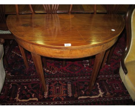 A MAHOGANY AND SATINWOOD INLAID SIDE TABLE 19th Century of demi-lune outline the shaped moulded top with inlaid panel above a