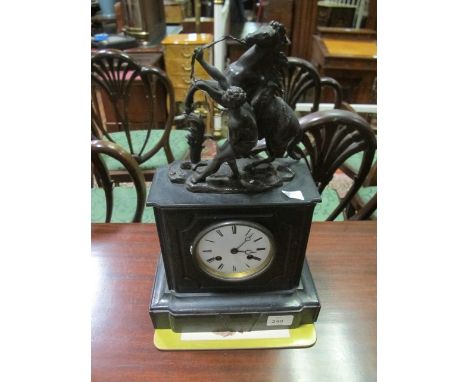 A BLACK SLATE MANTLE CLOCK surmounted with a marly horse the rectangular case with enamel dial and Roman numerals on stepped 