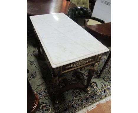 A CONTINENTAL WALNUT AND GILT BRASS MOUNTED SIDE TABLE surmounted with a white vein marble top raised on square tapering legs