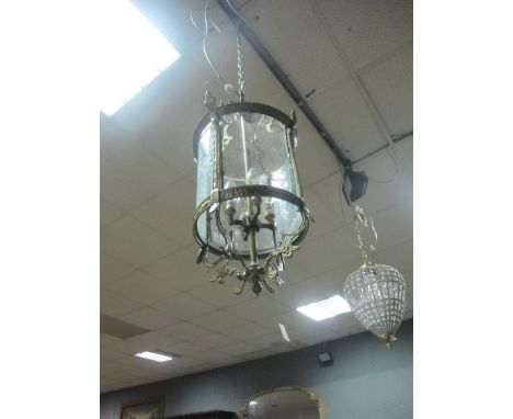 A GILT BRASS AND ENGRAVED GLASS FOUR LIGHT HALL LANTERN of cylindrical form with etched glass panels