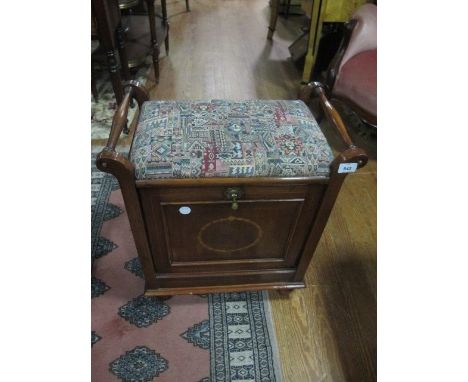 AN EDWARDIAN MAHOGANY SATINWOOD INLAID MUSIC SEAT the rectangular upholstered seat with baluster arms above a hinged compartm