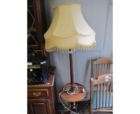 A MAHOGANY FLOOR STANDARD LAMP the reeded column joined by a circular dish raised on tripod support with shade