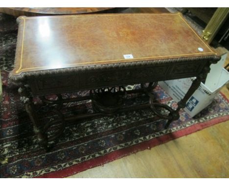 A FINE CONTINENTAL BURR WALNUT SIDE TABLE the rectangular top with eared corners and satinwood string inlay above a carved fr