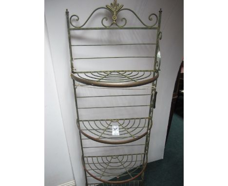A CAST METAL AND BRASS SHELF of demi-lune outline with scroll decoration 183cm (h) x 61cm (w) 30cm (d)