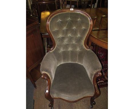 A VICTORIAN MAHOGANY UPHOLSTERED GENT'S CHAIR the arched top rail above a button upholstered panel seat with scroll arms on c