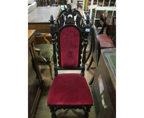 A JACOBEAN STYLE SIDE CHAIR the pierced scroll top rail above an upholstered panel and seat between baluster uprights on moul