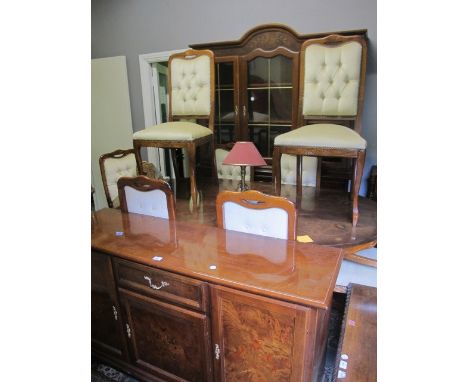 AN ELEVEN PIECE WALNUT INLAID DINING SUITE comprising eight dining chairs each with a button upholstered back and seat on cab