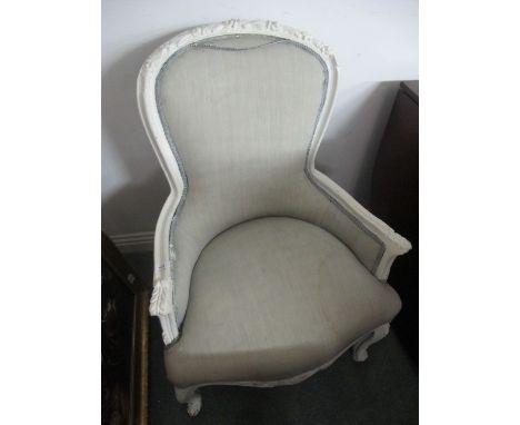 A CONTINENTAL WHITE PAINTED AND UPHOLSTERED ARMCHAIR each with a foliate carved top rail above an upholstered back and seat o